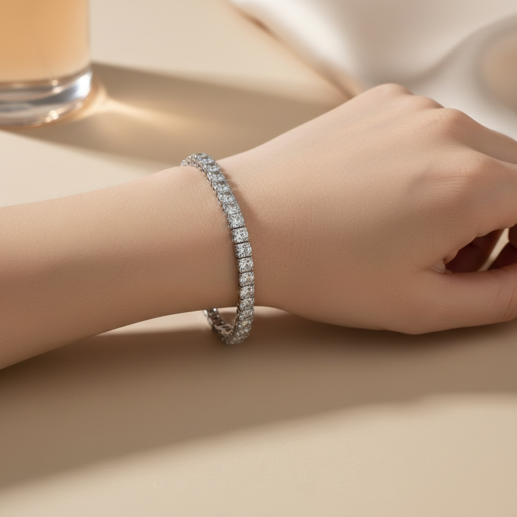 Silver bracelet with clear stones on a white background