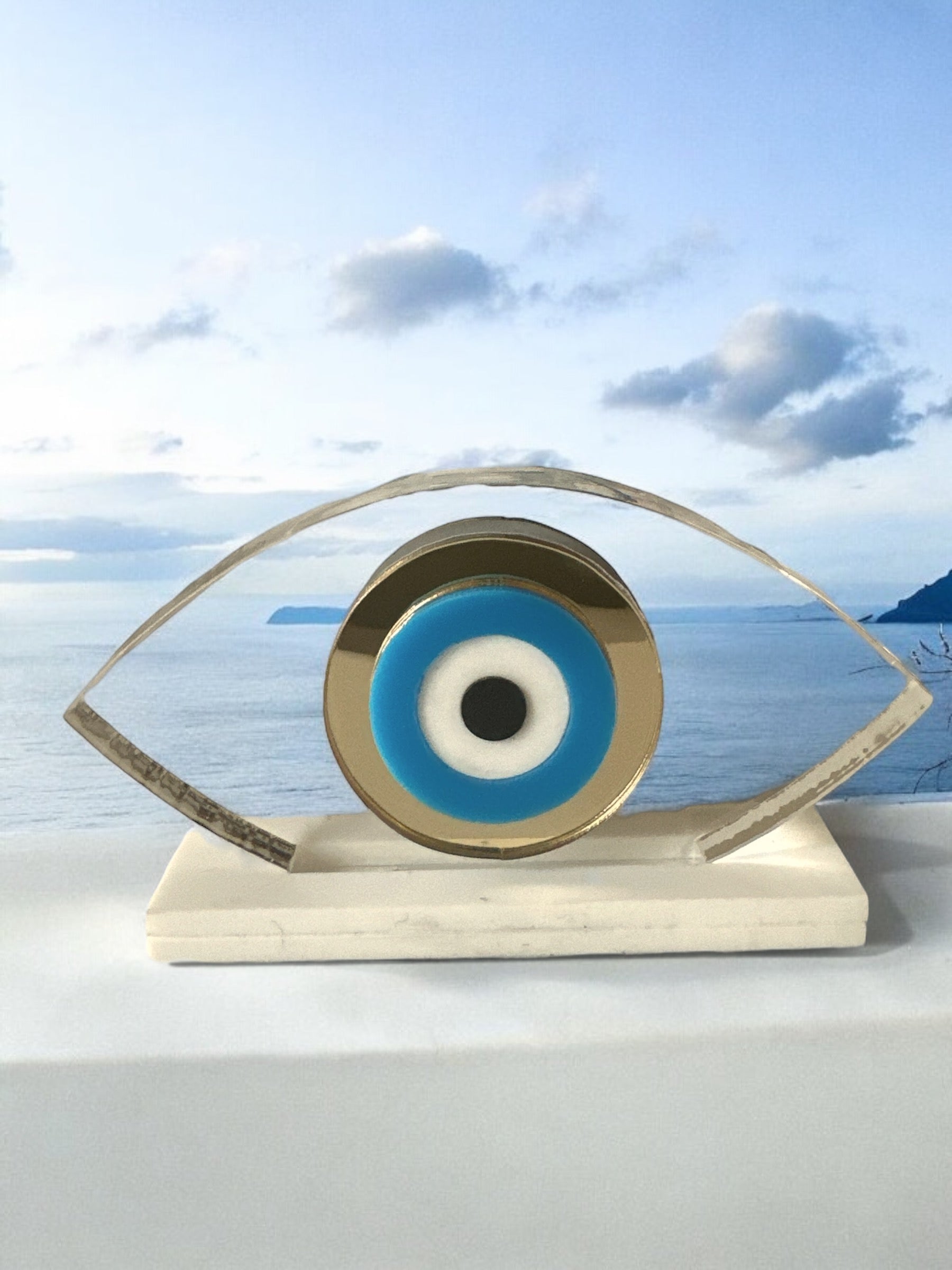 Γούρι διάφανο πλεξιγκλάς μικρό οβάλ μάτι σε βάση - So Cute by Dimi