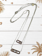 Διπλό ατσάλινο κολιέ με ζιργκόν, σε χρυσό και ασημί χρώμα, με κομψό industrial design