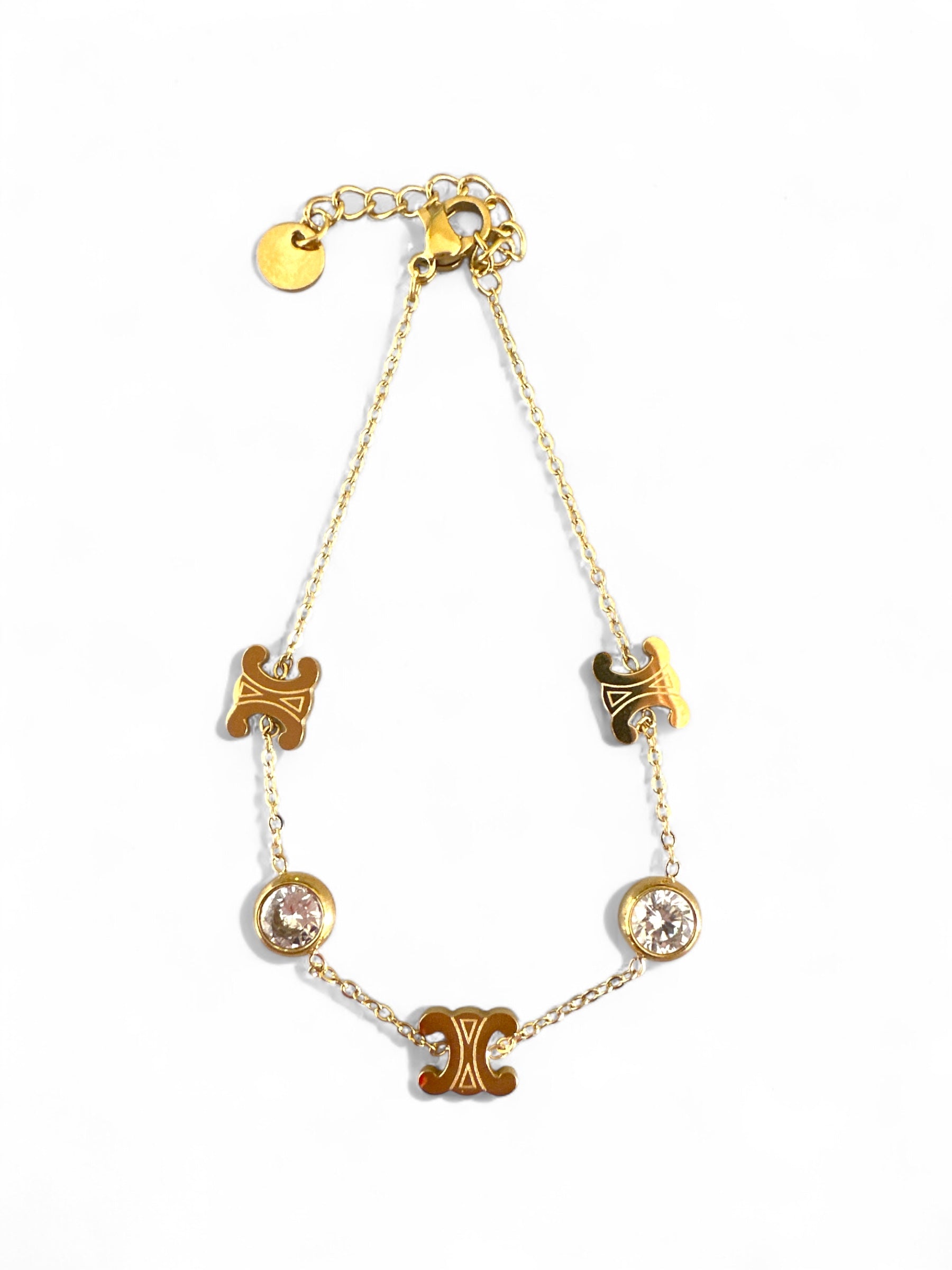 Ατσάλινο χρυσό βραχιόλι με λογότυπο “διπλό C” και δύο λευκά ζιργκόν σε λεπτή αλυσίδα