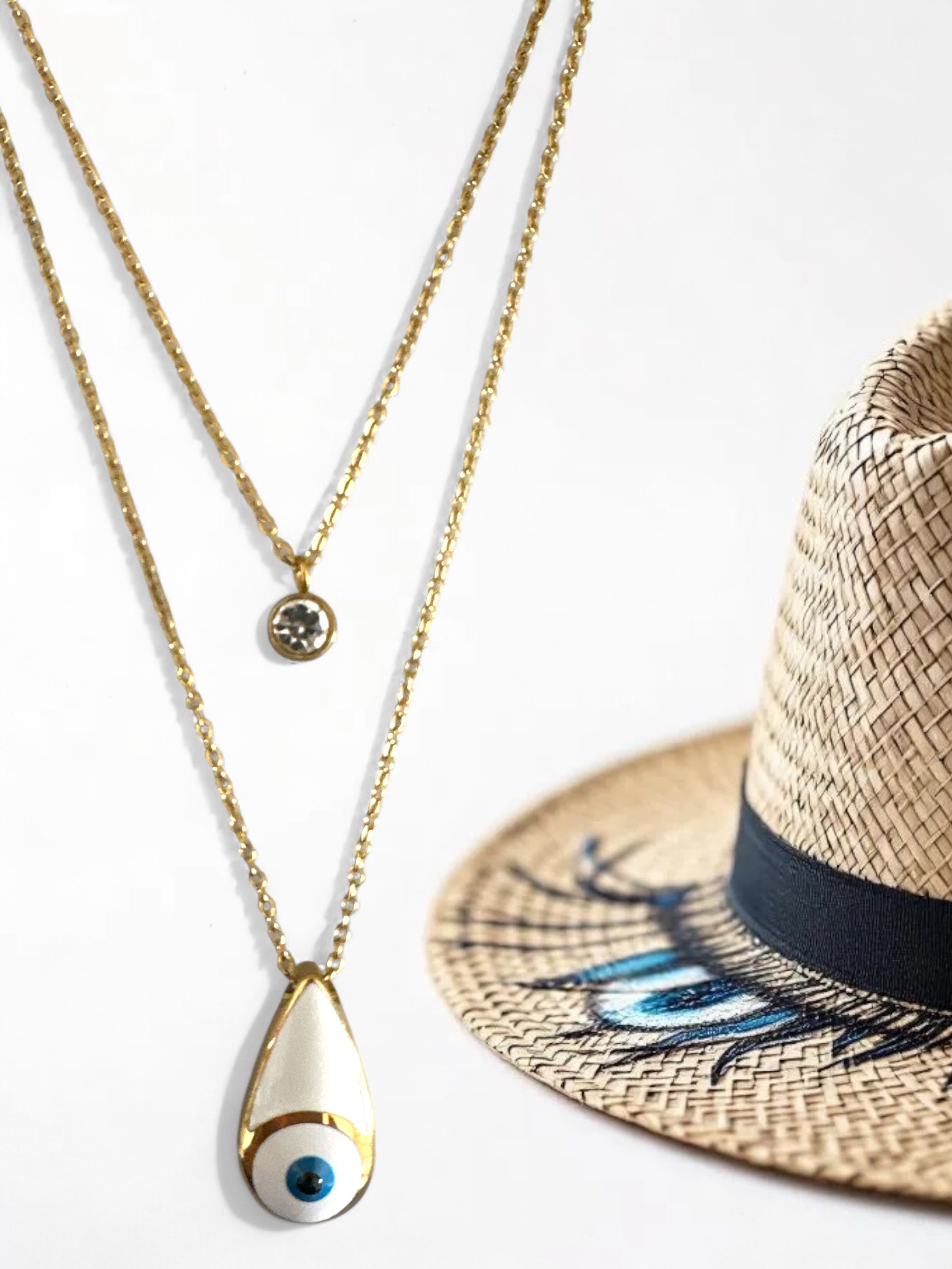 Διπλό ατσάλινο κολιέ σε χρυσό με μοτίφ μάτι σε σχήμα δάκρυ και στρας