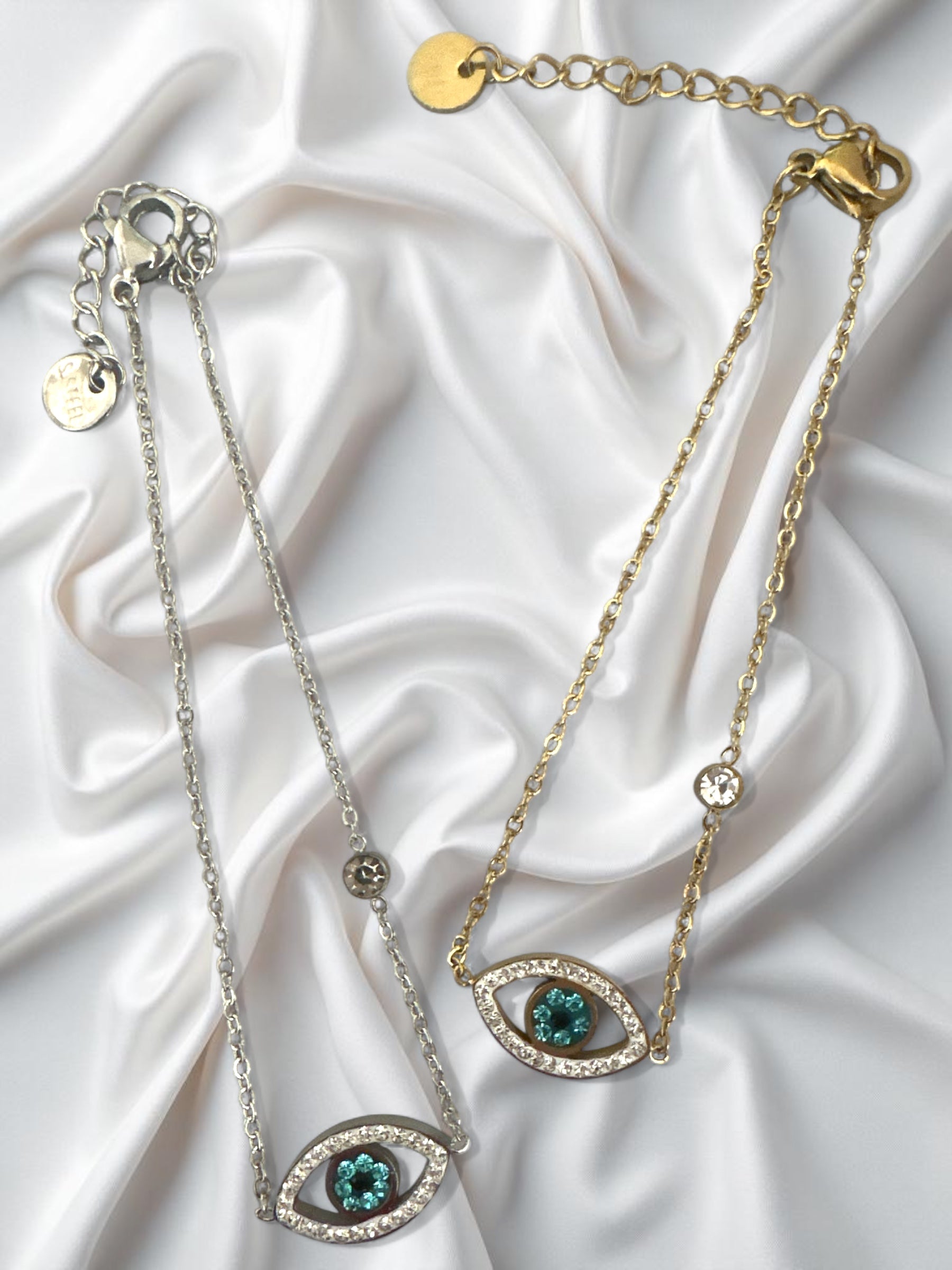 Ατσάλινα βραχιόλια με μάτι, στρας και κεντρική πέτρα σε χρυσό και ασημί φινίρισμα