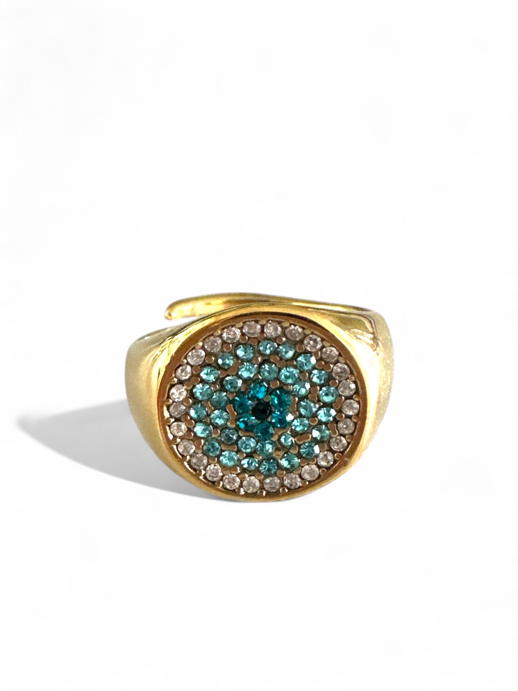 Gold ring with gemstones on a white background