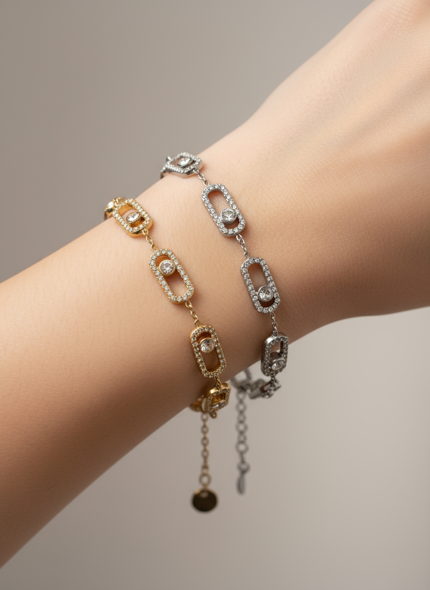 Ατσάλινα βραχιόλια So Cute By Dimi σε χρυσό και ασημί, με ορθογώνιους κρίκους διακοσμημένους με pavé ζιργκόν και κεντρικό μονό ζιργκόν.