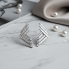 Ασημί ατσάλινα σκουλαρίκια με baguette ζιργκόν, So Cute by Dimi.