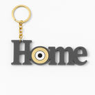 Χειροποίητο μπρελόκ HOME από γκρι plexiglass με μάτι σε χρυσό καθρέφτη – So Cute by Dimi