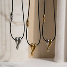 Κολιέ Melted Heart από ατσάλι σε χρυσό, ασημί και δίχρωμο με μαύρο κορδόνι, μήκους 80 εκ.