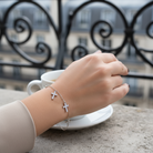 Ατσάλινο βραχιόλι με σταυρούς ζιργκόν σε  ασημί – So Cute by Dimi