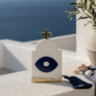 Γούρι design plexiglass σε σχήμα κυκλαδίτικου ναού με navy μάτι και χρυσό σταυρό, με navy φούντα – So Cute by Dimi