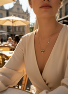 Ατσάλινα κολιέ με σχέδιο ματιού σε χρυσό και ασημί, διακοσμημένα με πράσινο κρύσταλλο και στρας
