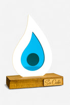 Γούρι plexiglass σταγόνα με τυρκουάζ mirror σε ξύλινη βάση – So Cute by Dimi