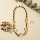 Rhombus Glow Necklace – Ατσάλινο κολιέ με ρομβοειδείς συνδέσμους και ζιργκόν σε χρυσό, So Cute by Dimi