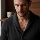 Ανδρικό ατσάλινο κολιέ με δάκρυ-ματάκι από ορείχαλκο σε ασημί χρώμα. So Cute by DImi