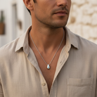 Ανδρικό ατσάλινο κολιέ με δάκρυ-ματάκι από ορείχαλκο σε ασημί χρώμα. So Cute by DImi