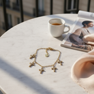 Ατσάλινο βραχιόλι με σταυρούς ζιργκόν σε χρυσό– So Cute by Dimi